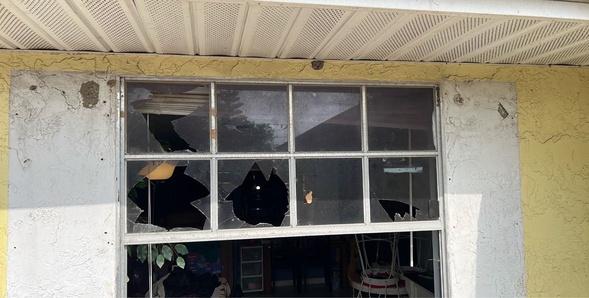 Broken plate glass window panes with sharp shards