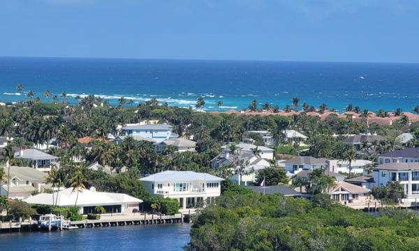 Coastal view through a sliding glass door
