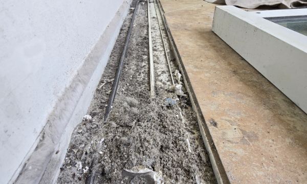 Sliding door track full of beach sand