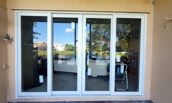 Newly installed white sliding glass door