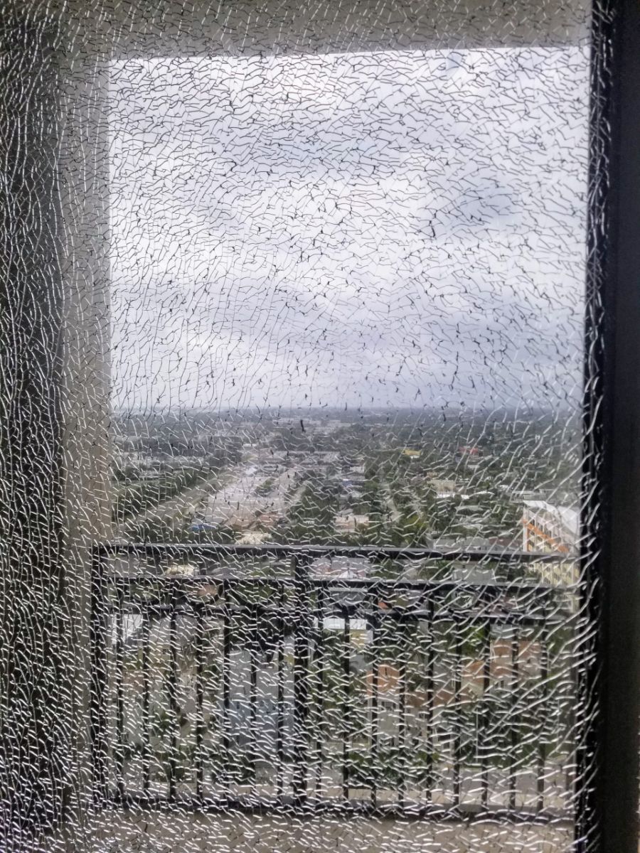 Shattered tempered glass in a sliding door